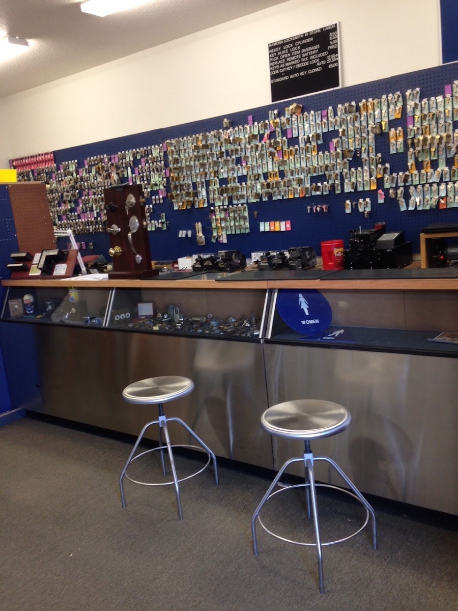 Shop counter with a wall of key blanks at PJ's Lock & Safe